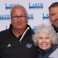 Group of alumni posing together at camera